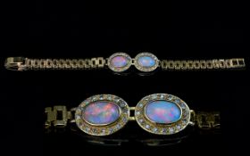 Ladies Attractive 9ct Gold Opal & Diamond Set Bracelet. The two central oval shaped opals of