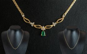 9ct Gold Necklace, set with an Emerald & Diamond drop.