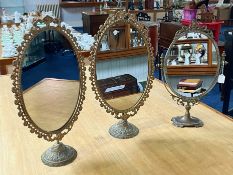 Three Brass Continental Style Toilet/Hall Table Mirrors. Approx height 22''.