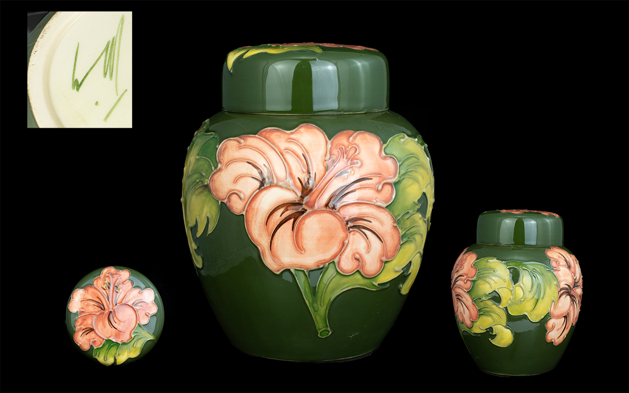 Moorcroft Modern Tube lined Lidded Ginger Jar ' Pink Hibiscus ' Design on Green Ground.