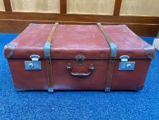 Large Vintage Suitcase, brown with strapping and studs. Measures 17'' wide x 28'' long x 11'' high.