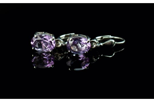 Amethyst Drop Earrings, oval cut amethyst solitaires totalling 2cts suspended from platinum