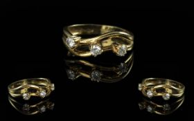 18ct Gold Attractive and Contemporary 3 Stone Diamond Set Ring. Marked 750 - 18ct to Shank. The 3