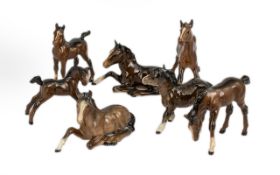 A Collection of 7 Beswick Foals various models to include, model 915 'Foal Lying',