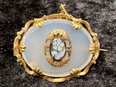 A Victorian Hard Stone Pendant central floral decoration with a yellow metal mount.