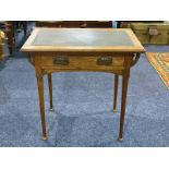 Early 20th Century Arts & Crafts Style Oak Games Table, swivel hinged top, green baize interior.