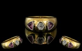 18ct Diamond Designer Ring, set with a hexagon shaped diamond between two trillion cut rubies.