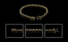 14ct Gold - Fancy Design Diamond Set Line Bracelet, Marked 14ct.