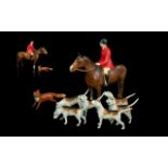 A Beswick Huntsman Model 1501 Brown Colourway together with 6 hounds and a fox.