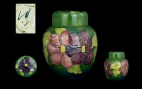 Moorcroft Modern Tube lined Lidded Ginger Jar ' Clematis ' Design on Green Ground.