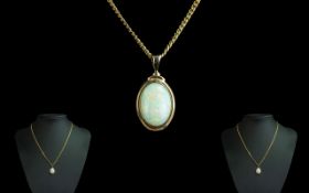 9ct Gold Attractive Opal Set Pendant Attached to a 9ct Gold Chain. Both Marked for 9.375.