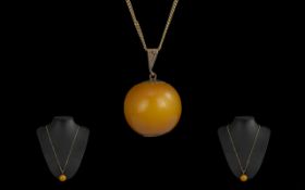 Antique Period Large 9ct Gold Mounted Butterscotch Amber Bead/Pendant Drop, marked 9ct.