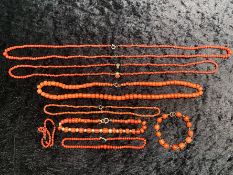 Two Antique Indonesian Red Coral Necklaces, together with associated coral beads.