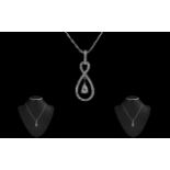 18ct White Gold Diamond Set Pendant In a Figure of Eight Design and Matching 18ct Gold Chain,