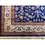 A Handmade Belgian Wool and Silk Rug. Beige ground. Measures 250 by 150m. In very good condition.