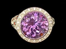 Amethyst and Garnet Stylish Ring, a 6ct round cut amethyst, with a halo of small white topaz,