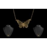 An Attractive 9ct Gold Butterfly Pendant with attached 9ct Gold Chain full hallmarks for 9.