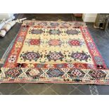 An Aztec Design Woolen Rug, Beige Ground, Bright Geometric Decoration, 360 x 275cm.