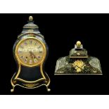 A Modern French Clock of shaped form black lacquered case with gilt highlights with pendulum and