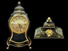 A Modern French Clock of shaped form black lacquered case with gilt highlights with pendulum and