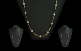 18ct Gold Attractive Necklace set with cultured pearl spacers, marked 750 - 18ct; weight 15.