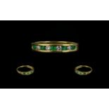 18ct Gold Emerald and Diamond Half Eternity Ring set with alternating round cut emeralds and