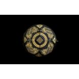 French Pique Work Brooch of round faceted form geometric gilt decoration.