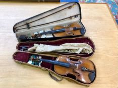 Two Violins in Cases, one in black case with accessories,