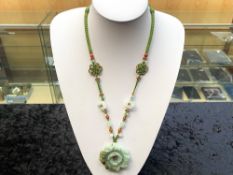 Green Jade Carved Flower Pendant Necklace, the necklace comprising carved multicolour jade beads and