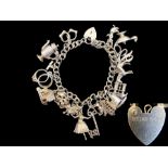 Silver Charm Bracelet Loaded with Different Charms, Includes a Key, Jug, Horse, Sailing Boat, Duck,
