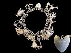 Silver Charm Bracelet Loaded with Different Charms, Includes a Key, Jug, Horse, Sailing Boat, Duck,
