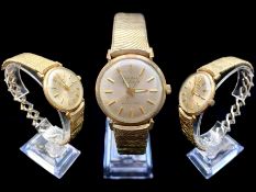 Gentleman's Bulova Wrist Watch, 10 ct Gold Filled, expanding bracelet, No. G496517, self winding.