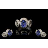 18ct White Gold Sapphire & Diamond Designer Ring, set with a central oval cut Sapphire between two