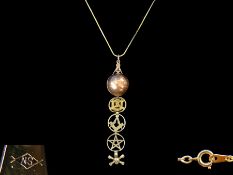 Unusual 9ct Gold Masonic Ball Pendant - Which opens to reveal 4 symbols that drop down.