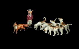 Beswick Hunting Figures comprising of a Fox and 5 hounds.