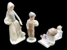 Three Nao Figures, comprising a boy with a football 8" tall,