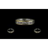 18ct Diamond Half Eternity Ring set with 7 round brilliant cut diamonds channel set stamped 750.