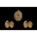 Middle Eastern Oriental Embossed Locket front and back depicting deities, yellow metal. 38 by 28 mm.