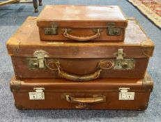 Collection of Three Vintage Suitcases, brown leather, with handles and locks, measuring 24",