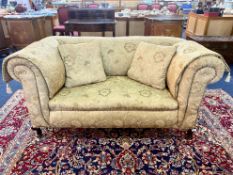 Edwardian Drop Arm Two Seater Sofa, damask fabric upholstery. Short cabriole legs and casters.