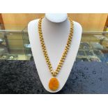 Honey Colour Jade Carved Pendant on Yellow Jade Necklace plus matching necklace; the pendant