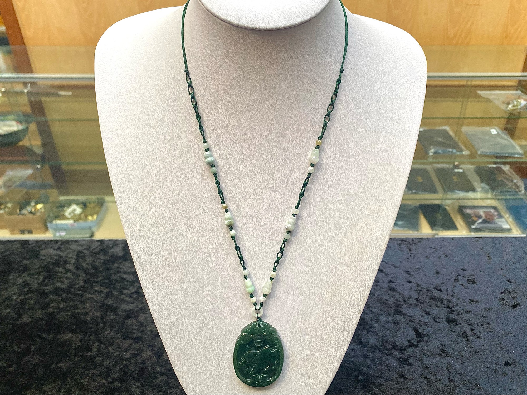 Two Jade Chinese Zodiac Pendant Necklaces, both pendants carved with a pig representing the the