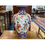 A Large Japanese Imari Temple Vase the panels depicting dancing girls amongst foliage and stylised