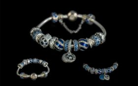 Pandora Signed Sterling Silver Charm Bracelet loaded with 14 Pandora charms,