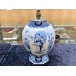 A Dutch Delft Ware Blue and White Lamp Base in the Chinoiserie design depicting figures foliage