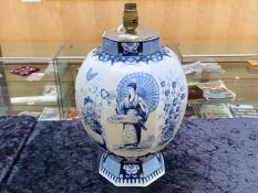 A Dutch Delft Ware Blue and White Lamp Base in the Chinoiserie design depicting figures foliage