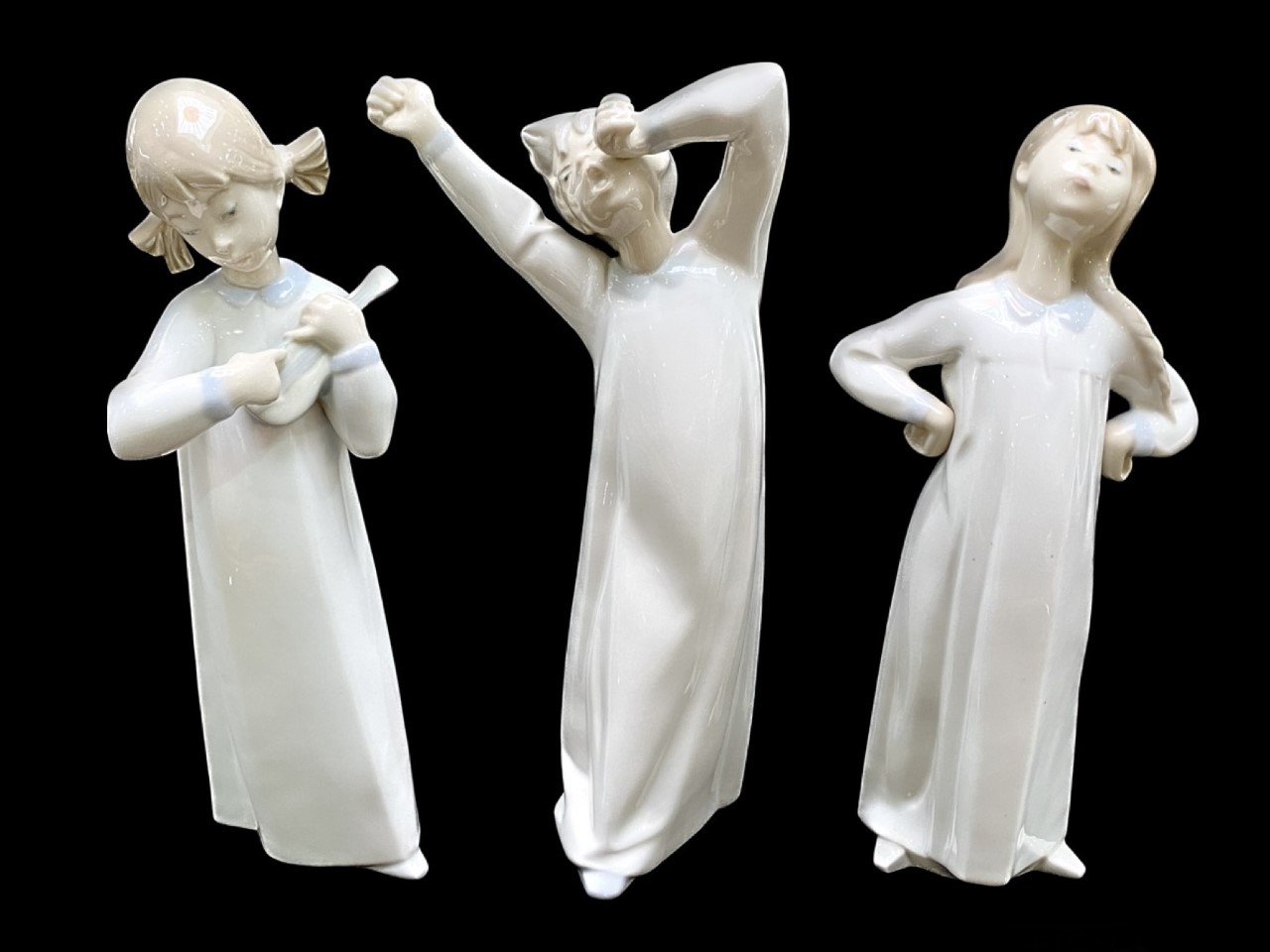 Three Lladro Figures, comprising 9" girl Lladro girl in nightdress, hands on hips,