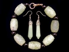 A Jade Bracelet with matching earrings.