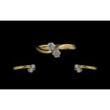 18ct Gold - Attractive 2 Stone Diamond Set Crossover Ring. Full Hallmark to Shank.