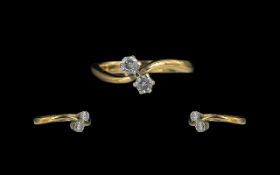 18ct Gold - Attractive 2 Stone Diamond Set Crossover Ring. Full Hallmark to Shank.